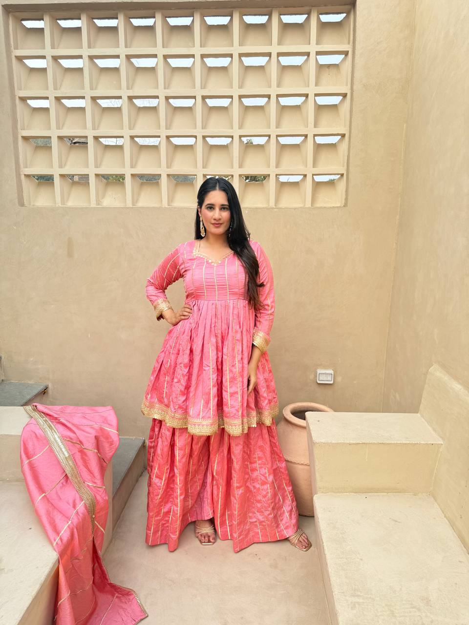 Radiant Rose Pink Flared Peplum Kurti and Sharara Set Embellished with Luminous Gold Zari Stripes and Sequined Borders